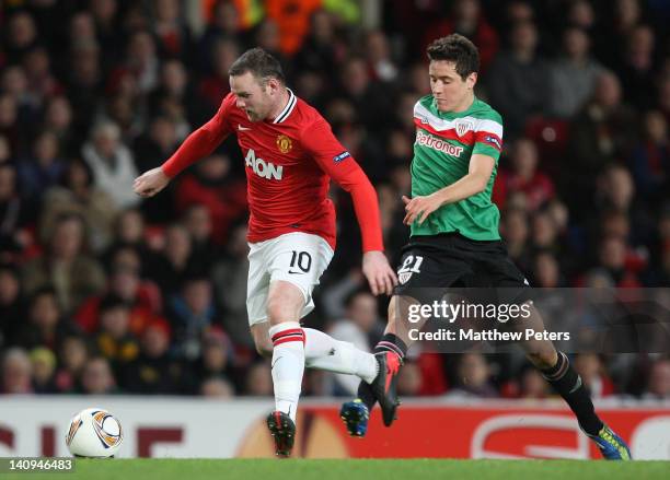 Wayne Rooney of Manchester United clashes with Ander Herrera of Athletic Club of Bilbao during the UEFA Europa League Round of 16 first leg match...