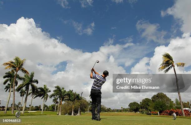 Paul Casey of England watches his tee shot on the second hole during first round of the World Golf Championships-Cadillac Championship on the TPC...