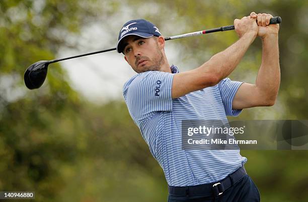 Jonathan Byrd watches his tee shot on the fifth hole during first round of the World Golf Championships-Cadillac Championship on the TPC Blue Monster...