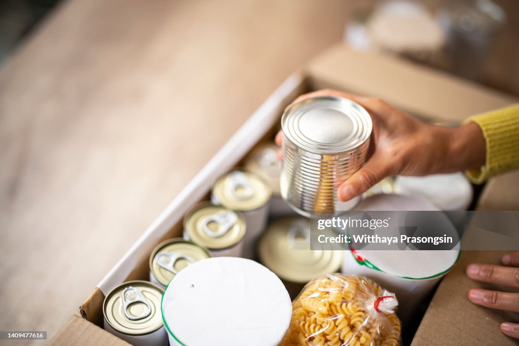 Working at charitable foundation, packing donation box