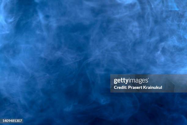 abstract blue smoke on a dark background - spooky smoke stock pictures, royalty-free photos & images