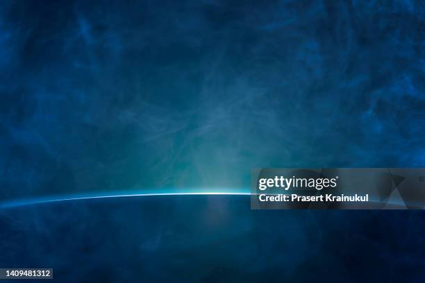 blue rays with blue smoke background - smoke atmosphere stock pictures, royalty-free photos & images