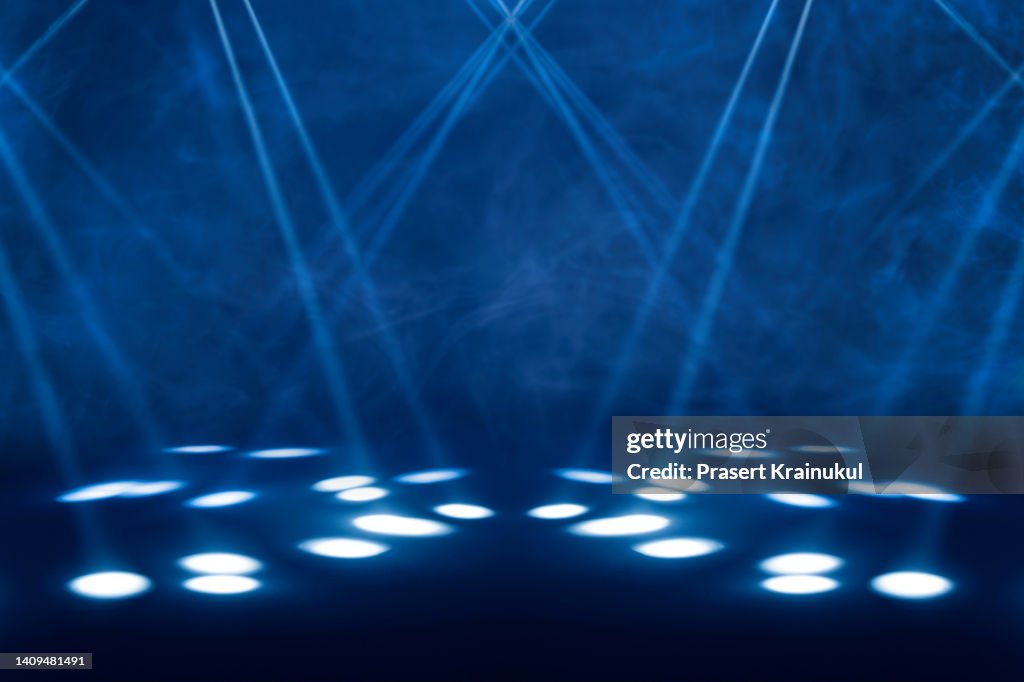 Blue stage under concert lighting