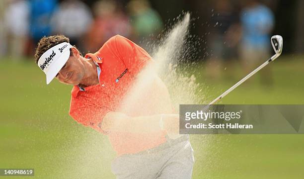 Keegan Bradley plays a bunker shot on the tenth hole during first round of the World Golf Championships-Cadillac Championship on the TPC Blue Monster...