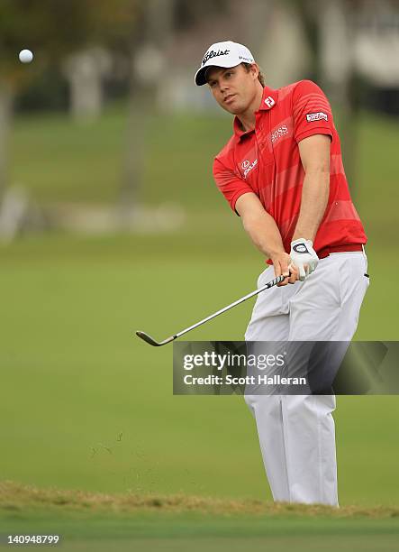 Nick Watney hits a pitch shot on the second hole hole during first round of the World Golf Championships-Cadillac Championship on the TPC Blue...