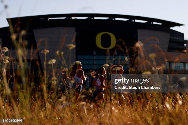 Athletes pass Autzen Stadium during the Women's Marathon on day four of the World Athletics Championships Oregon22 at Hayward Field on July 18, 2022...