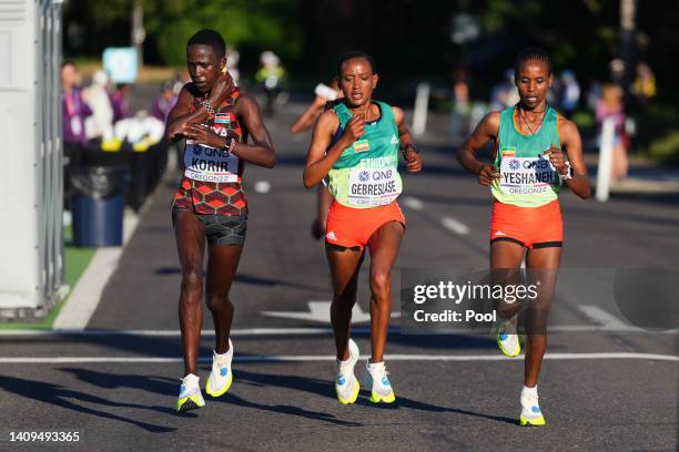 Judith Jeptum Korir of Team Kenya, Gotytom Gebreslase of Team Ethiopia, and Ababel Yeshaneh of Team Ethiopia compete in the Women's Marathon on day...