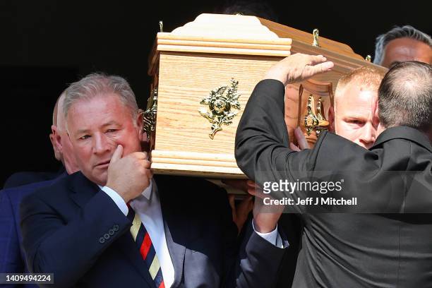 Ally McCoist helps carry the coffin of Rangers' greatest ever goalkeeper Andy Goram as it departs from Wellington Church on July 18, 2022 in Glasgow,...