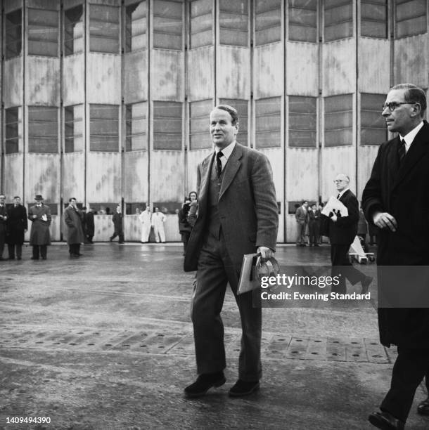 Royal Air Force pilot John Cunningham , Chief Test Pilot at Hawker Siddeley and the de Havilland Aircraft Company, arriving for the maiden flight of...