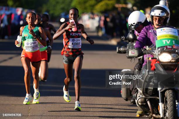 Gotytom Gebreslase of Team Ethiopia and Judith Jeptum Korir of Team Kenya compete in the Women's Marathon on day four of the World Athletics...