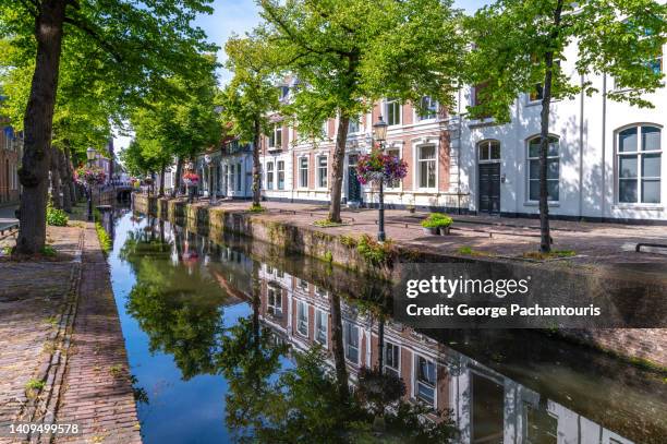 calm canal in the old town of amersfoort, holland. - amersfoort netherlands fotografías e imágenes de stock