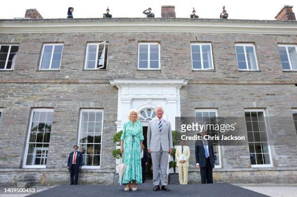 Camilla, Duchess of Cornwall and Prince Charles, Prince of Wales arrive at a garden party at Boconnoc House to mark the 70th anniversary of The Duke...
