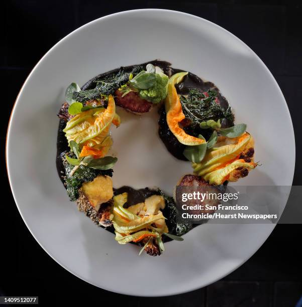 La Urbana in San Francisco features an entree, Cast Iron Scallop with cauliflower, sesame seeds, squash blossoms and kale, which features a Mexican...