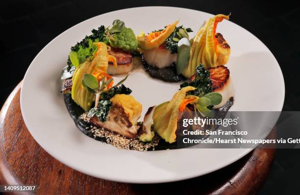 La Urbana in San Francisco features an entree, Cast Iron Scallop with cauliflower, sesame seeds, squash blossoms and kale, which features a Mexican...