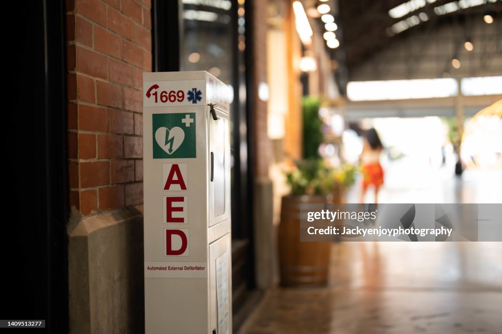 An Automated External Defibrillator, (AED) placed on the wall in public locations.