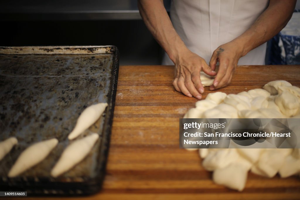 Salvador Ramirez, head baker at La Reyna Bakery in the Mission District of San Francisco, Calif., rolls out dough for Mexican bolillos on Saturday, May 17, 2014. The bakery has been in business for 49 years and at its current location on 24th Street for 3