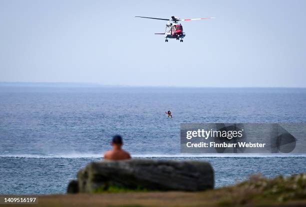 Coastguard search and rescue helicopter is seen off the Treyarnon Bay beach in Cornwall, on July 18, 2022 in Padstow, United Kingdom.