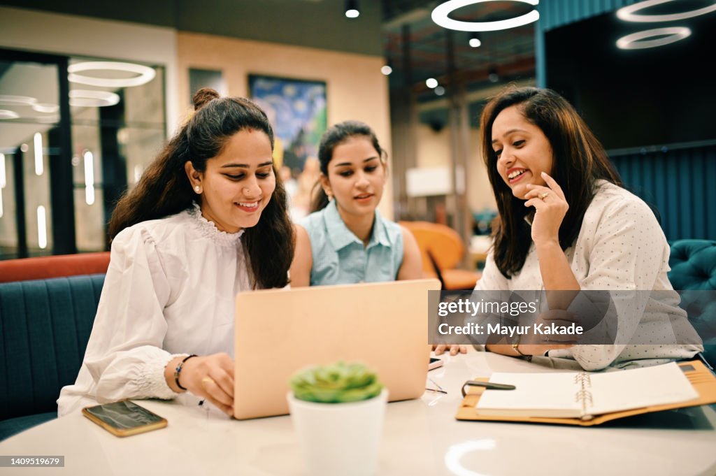 Group of women discussing in a co-working office
