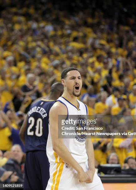 Klay Thompson celebrates after hitting a three point shot during the second half. The Golden State Warriors played the New Orleans Pelicans in Game 2...