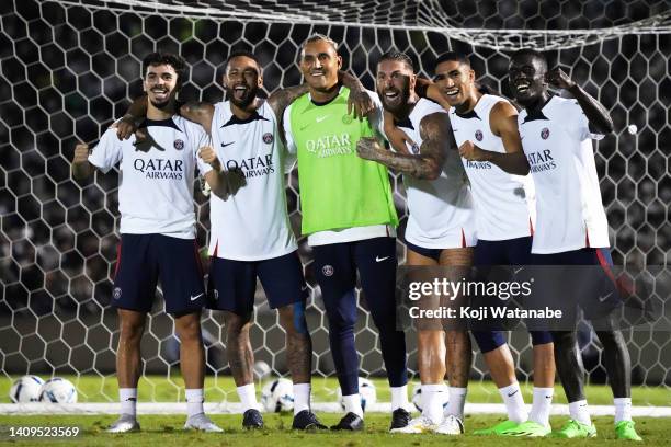 Neymar Jr and Keylor Navas and Sergio Ramos of Paris Saint-Germain celebrate with team mat the Paris Saint-Germain training session at Prince...