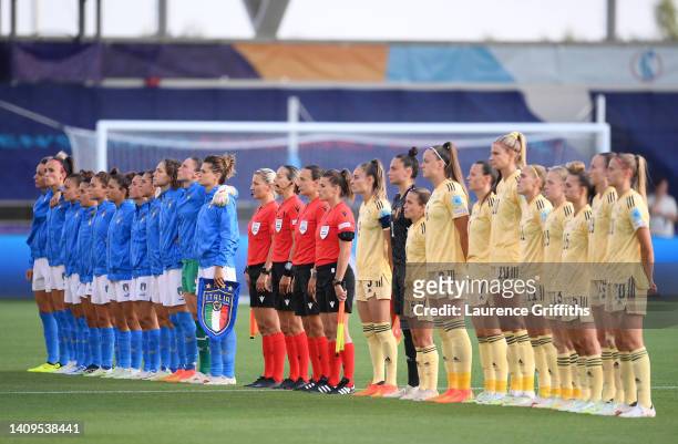 Both teams line up for the national anthems prior to the UEFA Women's Euro 2022 group D match between Italy and Belgium at Manchester City Academy...