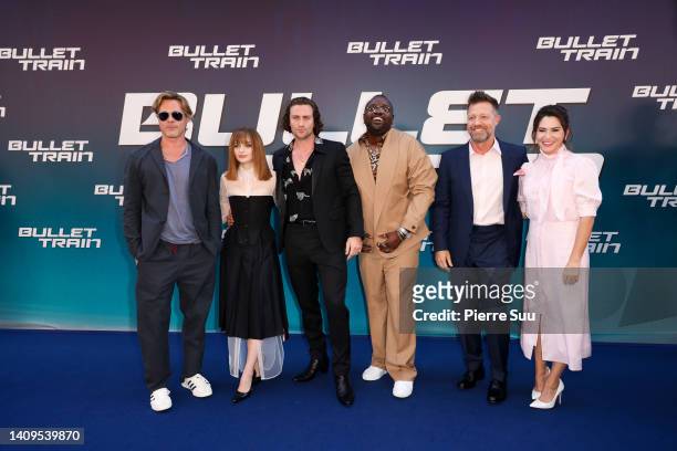 Brad Pitt, Joey KIng,Aaron Taylor-Johnson, Brian Tyree Henry, David Leitch and Kelly McCormick attend "Bullet Train" Premiere At Le Grand Rex on July...