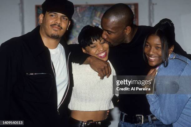 Adina Howard appears backstage with Christopher Williams, Malik Yoba and a member of SWV when she performs at Tramps on April 10, 1995 in New York...