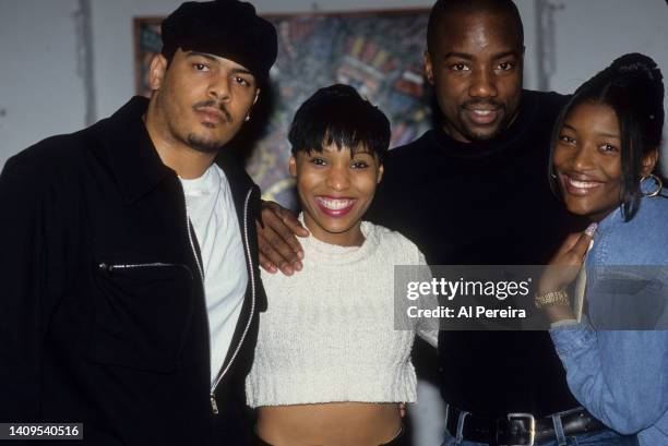 Adina Howard appears backstage with Christopher Williams, Malik Yoba and a member of SWV when she performs at Tramps on April 10, 1995 in New York...