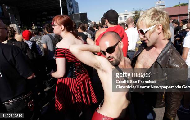 Joe Meschede, left, and Alex Steinhaus, of San Francisco, dance to the music of The Presets at the Folsom Street Fair.