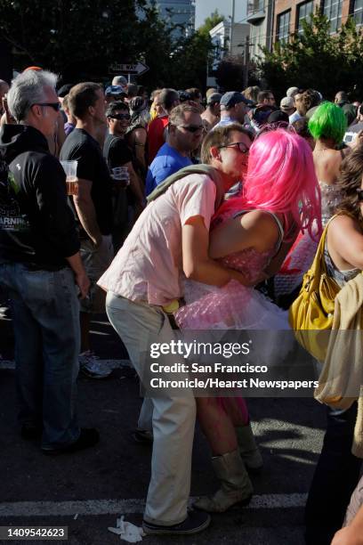 Lisa Schamberger, and John Smith, of Muir Beach, share a kiss while waiting for Berlin to perform. The two met at the Folsom Street Fair the previous...