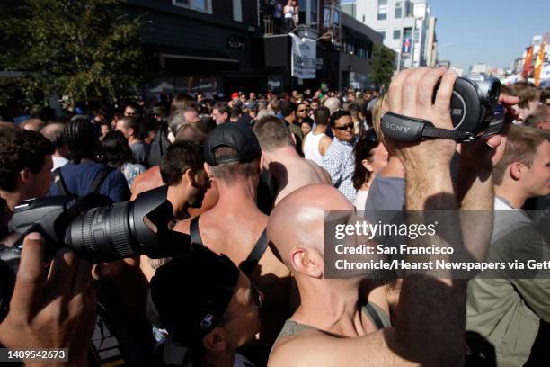 Orwins Cunill, of Sacramento, films some of the activities at the Folsom Street Fair. Thousands attended the 25th anniversary Folsom Street Fair in...