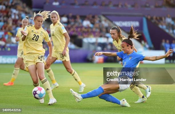 Barbara Bonansea of Italy shoots past Julie Biesmans of Belgium during the UEFA Women's Euro 2022 group D match between Italy and Belgium at...