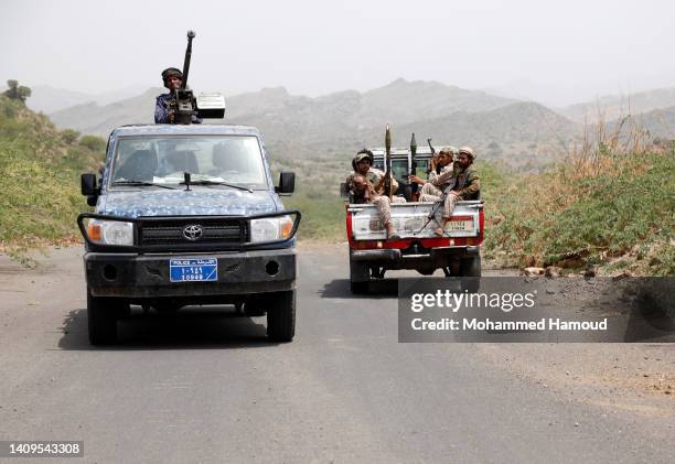 Fighters of the Houthi group riding military vehicles while patrolling at AL-Khamseen street, which leads to the center of Taiz city amid a...