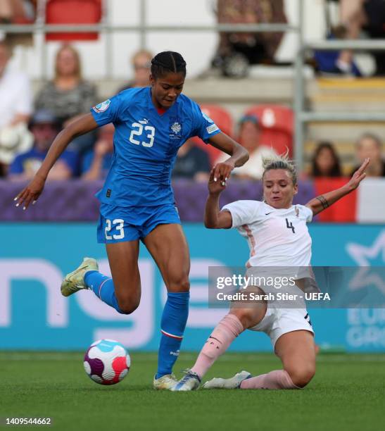 Sveindis Jonsdottir of Iceland is challenged by Marion Torrent of France during the UEFA Women's Euro 2022 group D match between Iceland and France...