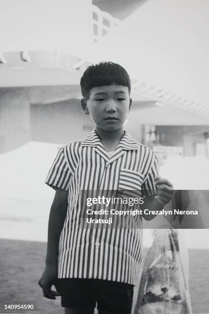 boy holding plastic bag with goldfish and stone - japan 1960s stock pictures, royalty-free photos & images