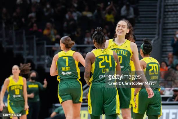 Breanna Stewart of the Seattle Storm is congratulated by Jewell Loyd after making a three point basket against the Indiana Fever in the second half...