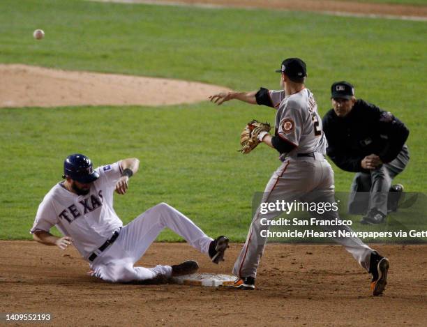 San Francisco Giants second baseman Freddy Sanchez completes a double play on Texas Rangers right fielder Jeff Francoeur in the sixth inning on a...