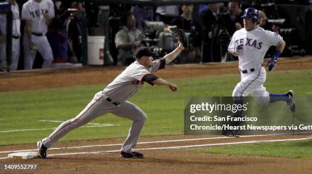 San Francisco Giants first baseman Aubrey Huff makes the play on Texas Rangers' Ian Kinsler in the second inning during game 5 of the 2010 World...