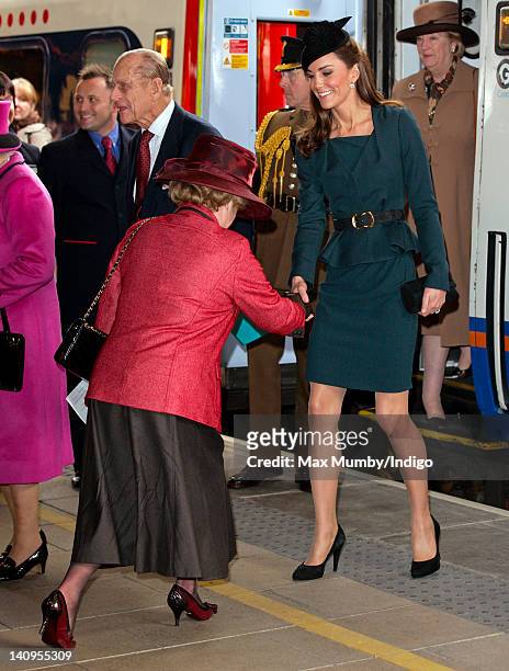 Lady Gretton curtseys to Catherine Duchess of Cambridge as The Duchess, Queen Elizabeth II and Prince Philip, Duke of Edinburgh arrive at Leicester...