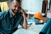 Architect using phone at workplace