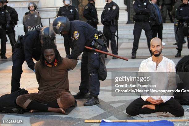 Police from various agencies move in to clear out Occupy Oakland protesters and their tents from Frank Ogawa Plaza in Oakland, Calif., on Monday,...