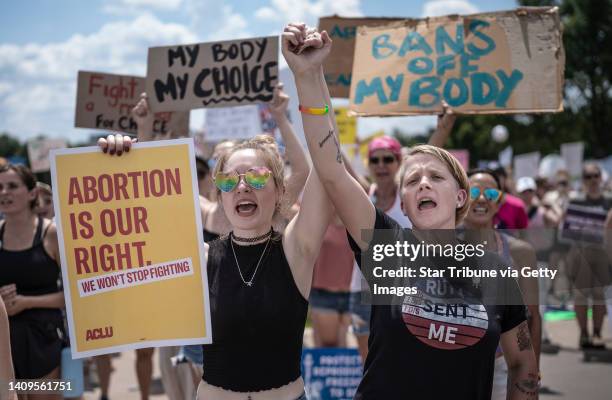 McKayla Wolff left and Karen Wolff, joined hands as they rallied for abortion rights at the capitol in St. Paul, Minn., on Sunday July 17, 2022....
