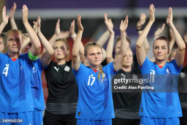 Agla Maria Albertsdottir of Iceland acknowledges the fans with teammates following the UEFA Women's Euro 2022 group D match between Iceland and...