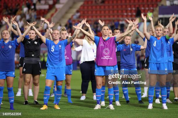 Gunnhildur Jonsdottir, Sara Bjork Gunnarsdottir and Glodis Viggosdottir of Iceland acknowledge the fans with teammates following the UEFA Women's...