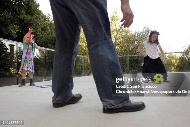 Joshua Safran plays with his daughters, Sivan and Ketriel at their Oakland, Calif., home on Sunday, August 18, 2013. Safran has written a memoir...