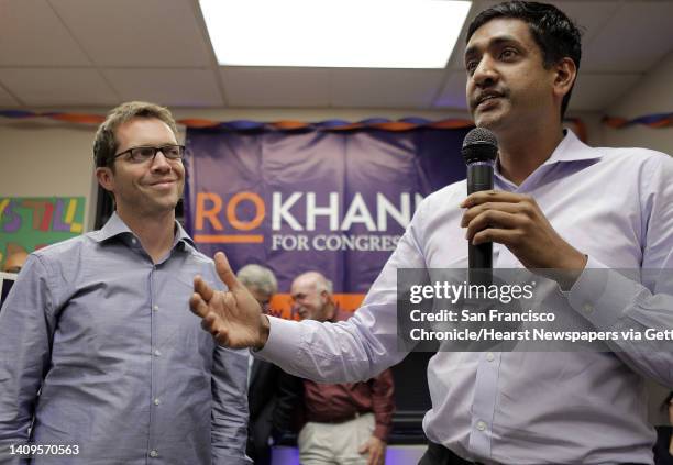 Ro Khanna, right, addresses supporters gathered at a new campaign center for the democratic challenger as he is joined on stage by Jeremy Bird, left,...