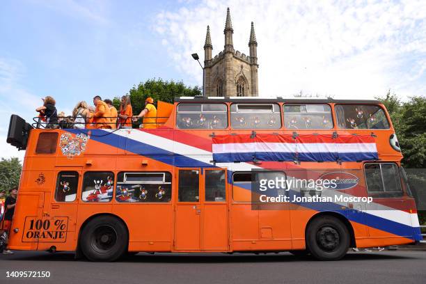 Netherlands fans follow a decorated bus to the stadium prior to the UEFA Women's Euro England 2022 group C match between Switzerland and Netherlands...