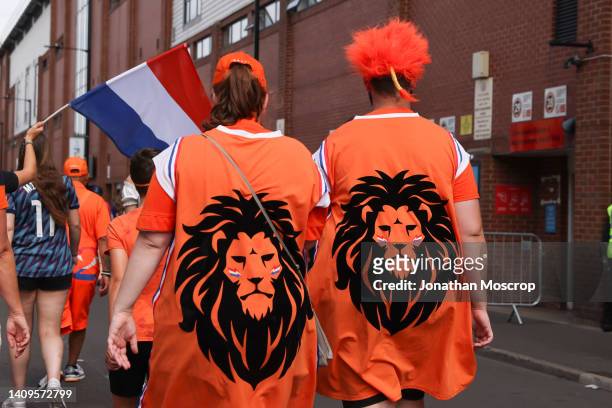 Netherlands fans make their way to the stadium during the UEFA Women's Euro England 2022 group C match between Switzerland and Netherlands at Bramall...