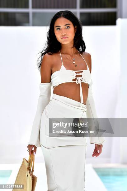 Model walks the runway wearing Paradox by Kaya with Bhāvyaa jewelry during Flying Solo Miami Swim Week 2022 on July 18, 2022 in Miami Beach, Florida.