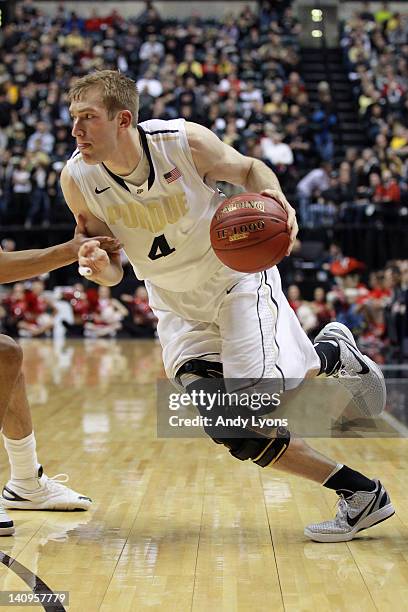 Robbie Hummel of the Purdue Boilermakers drives against the Nebraska Cornhuskers during their first round game of 2012 Big Ten Men's Basketball...